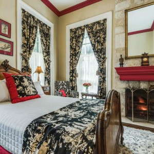 room with bed and fireplace