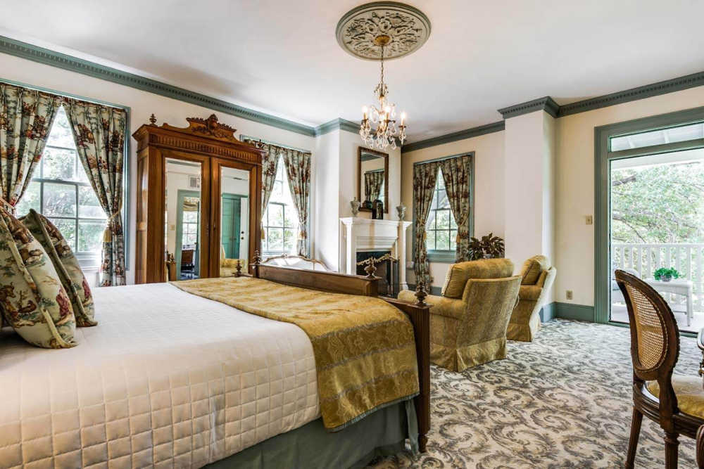 Luxurious guest room is San Antonio at Noble Inns with accents of green